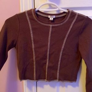 Cute brown crop top with stitches outlining the clothing from garage